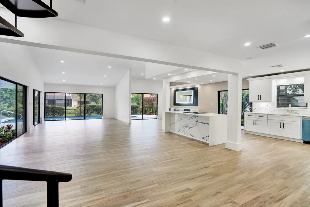 Open living area with wood-look flooring and sliding glass doors