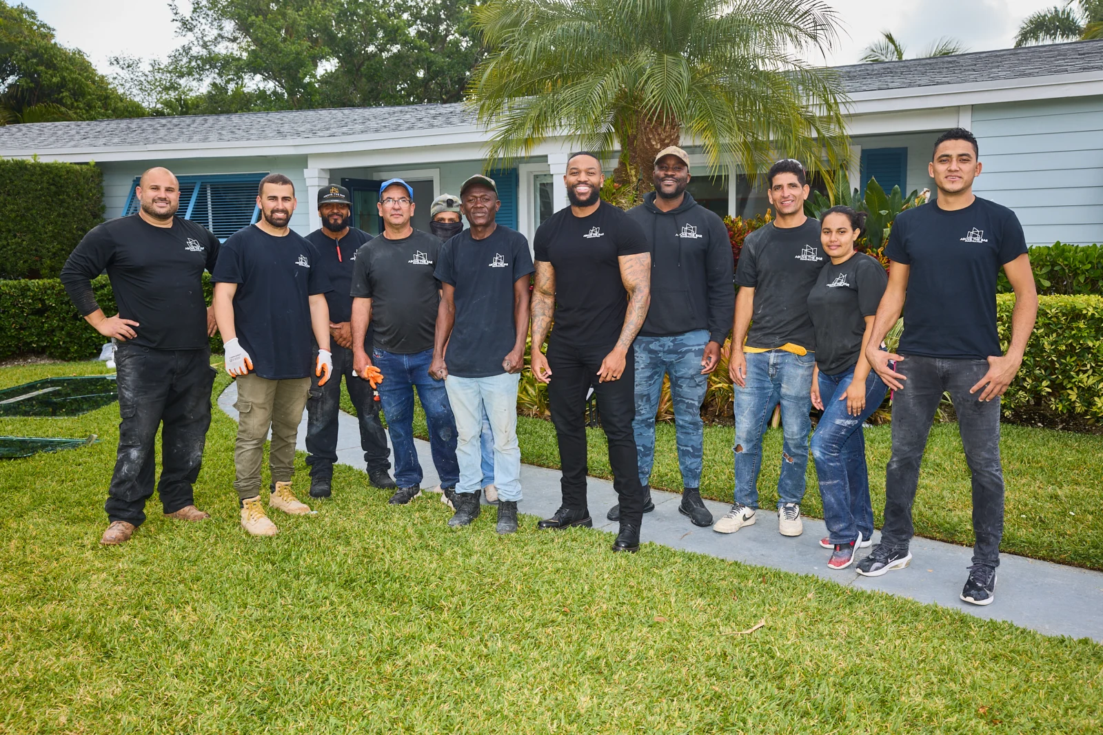 Above the Bar Construction team standing together outside a home